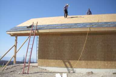 men working on a roof