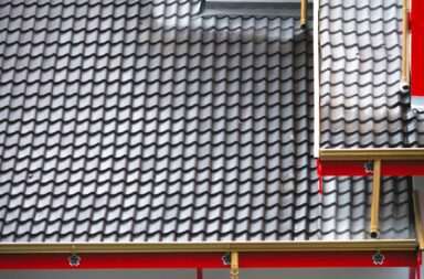 An architectural shot of a house exterior featuring a contemporary, tiled roof design.